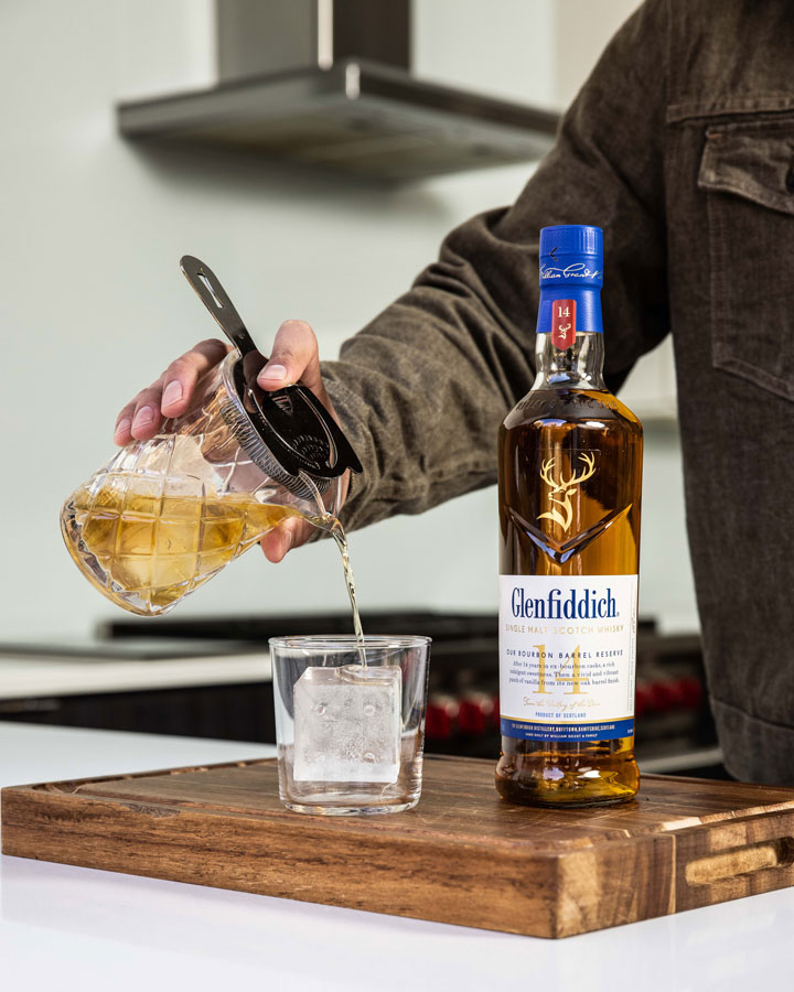 Glenfiddich 14 Year Old Bourbon Barrel Reserve Whisky bottle being poured